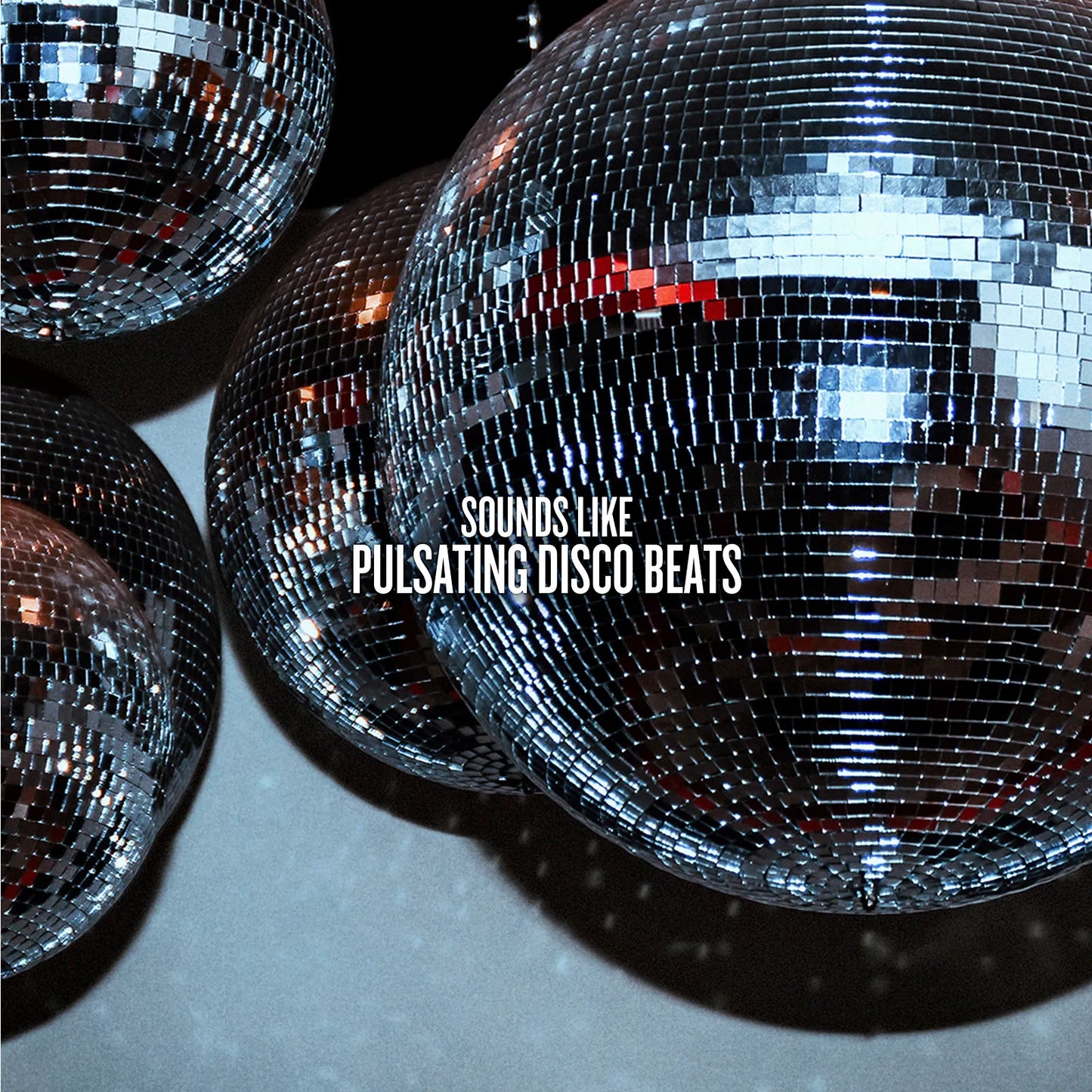 Close-up of a disco ball with text 'SOUNDS LIKE PULSATING DISCO BEATS' on a dark background