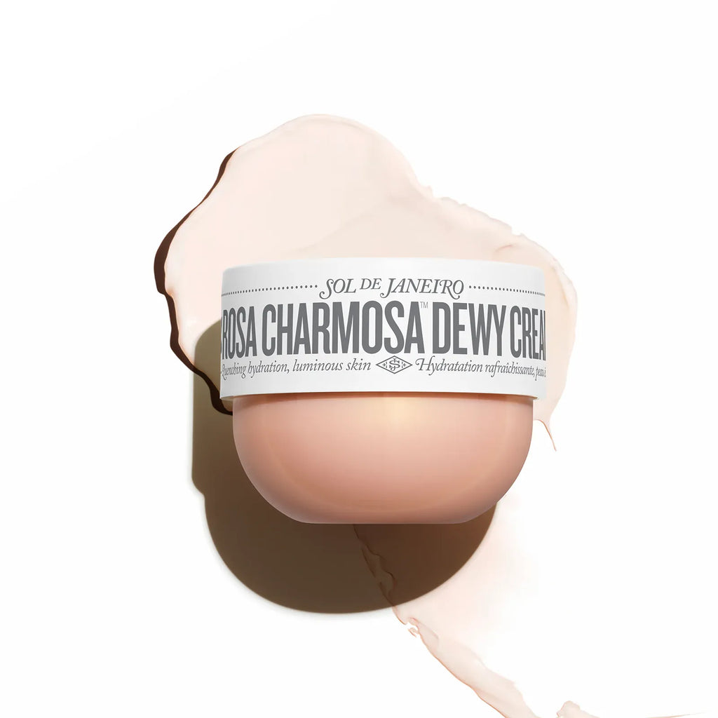 Cream container labeled 'Rosa Charmosa Dewy Cream' on a white background